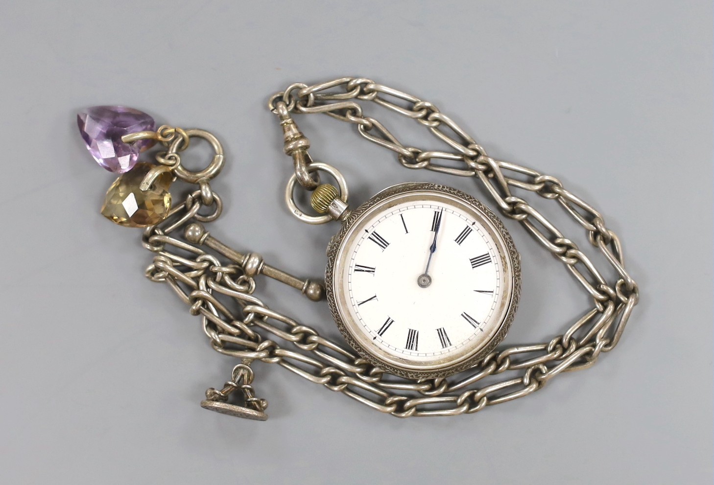 A lady's 9ct gold Omega manual wind wrist watch, a 935 white metal fob watch with albert and a silver open faced pocket watch.